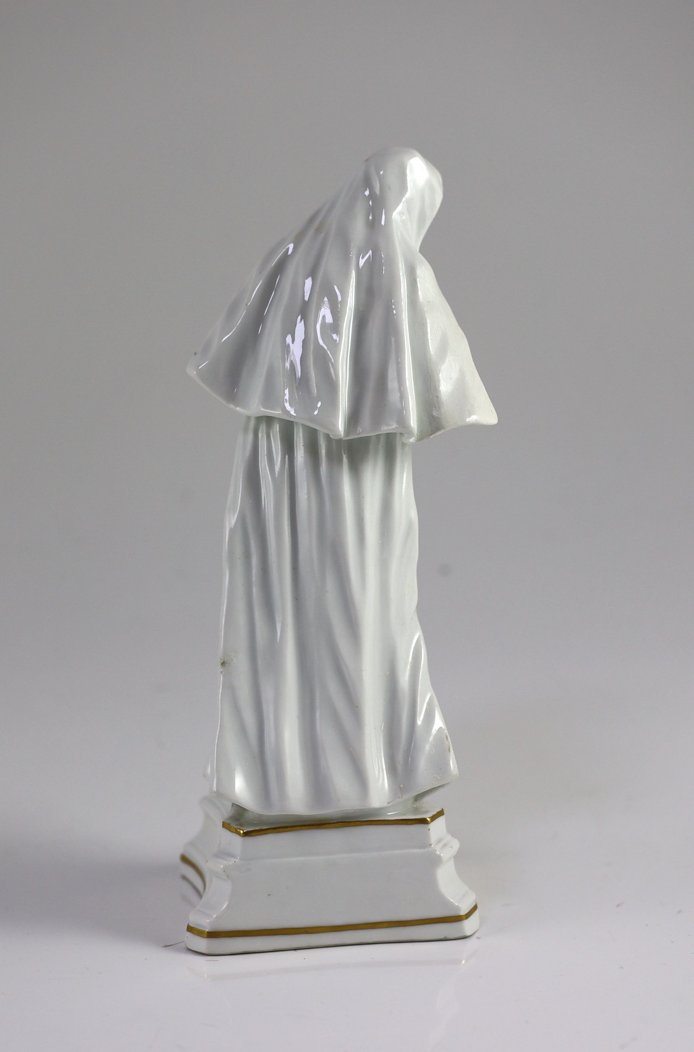 A Meissen figure of a Benedictine nun, c.1741, 24.5cm high, some restoration